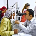 Doctors examining eye patients during free eye camp by LUMHS at health services hospital Jamshoro