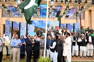 Consul General of Turkiye, Cemal Sango hoisting Pakistani flag at a ceremony to mark Marka-e-Haq, Independence Day Celebrations" (Shuhda Day) at Governor House