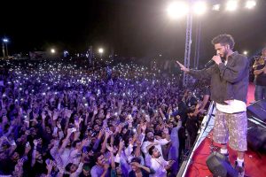 Singer performing during mega event of Pakistan Independence Day & Marka-e-Haq grand celebration at Rani Bagh