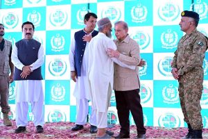 Prime Minister Muhammad Shehbaz Sharif distributing relief cheques among the victims of the recent torrential rains and floods in Buner