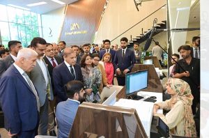 Prime Minister Muhammad Shehbaz Sharif is being briefed on different desks of Board of Investment's 1st Business Facilitation Center.
