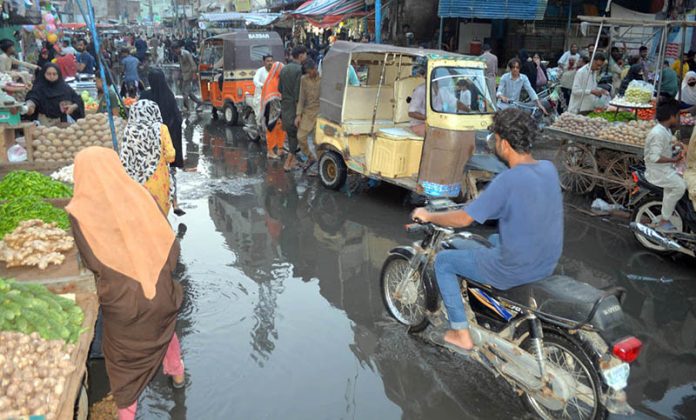 A view of sewerage water accumulated at Latifabad unit number 12 Road need the attention of concerned authorities
