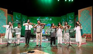 Singer performing during mega event of Pakistan Independence Day & Marka-e-Haq grand celebration at Rani Bagh