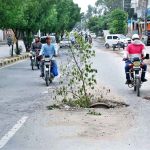 A view of broken sewerage system on Commissioner Office Road disrupting routine traffic.