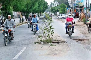 A view of broken sewerage system on Commissioner Office Road disrupting routine traffic.