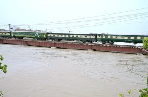 A view of Train on the way crossing the Phuleli railway bridge at Tando Yosuf area.