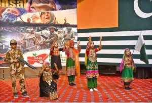 Students presenting a powerful tableau during a seminar on Youm-e-Istehsal (Day of Exploitation) at the Sargodha Arts Council, highlighting the plight of Indian Illegally Occupied Jammu and Kashmir.