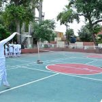Student badminton players in action during a match organized by the Government College Women University Faisalabad (GCWUF) to mark Independence Day and Marka-e-Haq