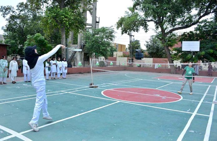 Student badminton players in action during a match organized by the Government College Women University Faisalabad (GCWUF) to mark Independence Day and Marka-e-Haq