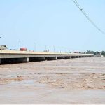 A view of floodwater from the River Chenab crossing dangerous levels at Talibwala Bridge, inundating several areas of Punjab following heavy rains and the opening of floodgates by India