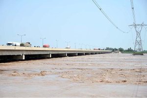 A view of floodwater from the River Chenab crossing dangerous levels at Talibwala Bridge, inundating several areas of Punjab following heavy rains and the opening of floodgates by India