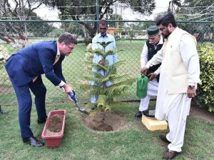 Newly appointed German Consul General Thomas E. Schultze plants a sapling during a plantation drive accompanied by Sindh Governor Kamran Khan Tessori at the Governor House.