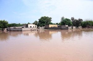 A view of floodwater from the River Chenab crossing dangerous levels at Talibwala Bridge, inundating several areas of Punjab following heavy rains and the opening of floodgates by India