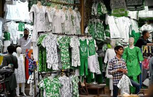 A street vendor selling the Pakistani flags at urdu bazar as the nation starts preparation to celebration of Independence Day in befitting manners.
