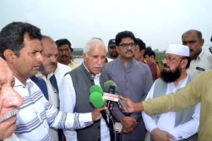 Federal Minister for Board of Investment, Qasir Ahmad Sheikh talking to media after visits flood-hit areas along Jhang–Chiniot Road, In Chiniot, around 100 villages and nearly 100,000 people have been affected by the heavy floods