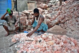 Labourers busy in preparing Khewra natural salt at a local store.
