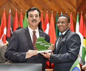 Dr. Jemal Beker Abdula Ambassador of Federal Democratic Republic of Ethiopia presenting a green legacy award to Chairman Senate, Syed Yousaf Raza Gilani.