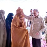 Prime Minister Muhammad Shehbaz Sharif distributing relief cheques among the victims of the recent torrential rains and floods in Buner