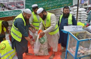 Pakistan Markazi Muslim League (PMML) party volunteers camp in Saddar bazar as they sort food rations to be sent to people who affected by flooding in KPK.