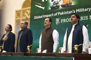 Chairman Senate Syed Yousaf Raza Gillani, Interior Minister Mohsin Naqvi, and Punjab Assembly Speaker Malik Ahmed Khan standing in respect during the national anthem at a seminar on 'Global Impact of Pakistan’s Military and Diplomatic Victories over India,' organized by Waris Mir Foundation at Aiwan-e-Iqbal.