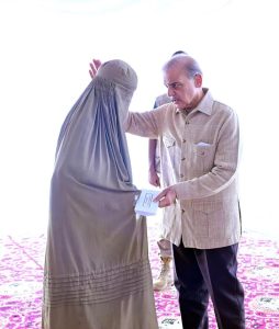 Prime Minister Muhammad Shehbaz Sharif distributing relief cheques among the victims of the recent torrential rains and floods in Buner