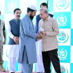Prime Minister Muhammad Shehbaz Sharif distributing relief cheques among the victims of the recent torrential rains and floods in Buner