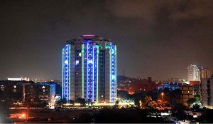 A residential building decorated with colorful lights in connection with the Rabi-ul-Awal celebrations.