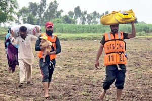 Rescue 1122 helping people to evacuate the flood area to safer place. 900000 cusec flood water crossing the area in River Chenab