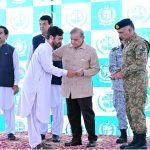 Prime Minister Muhammad Shehbaz Sharif distributing relief cheques among the victims of the recent torrential rains and floods in Buner
