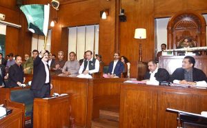 Sindh Chief Minister Syed Murad Ali Shah hoisting the national flag to mark National Minorities Day during the assembly session.