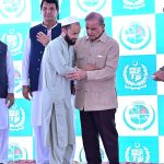 Prime Minister Muhammad Shehbaz Sharif distributing relief cheques among the victims of the recent torrential rains and floods in Buner