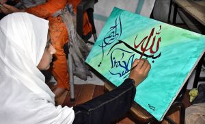 – An art student engaged in calligraphy during a art and calligraphy competition organized by the Formanite School System.