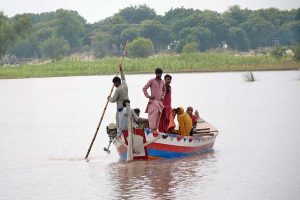 Rescue 1122 team evacuates flood-affected people to safer places by boat during a relief operation
