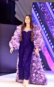 A model walks the ramp in a stylish outfit during the first inter-university fashion show competition at Government College Women’s University Faisalabad (GCWUF)