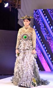 A model walks the ramp in a stylish outfit during the first inter-university fashion show competition at Government College Women’s University Faisalabad (GCWUF)