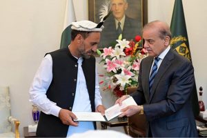 Prime Minister Muhammad Shehbaz Sharif presents prize cheques to Shepherds from Ghizer Gilgit Balitistan Wasiyat Khan, Ansar and Muhammad Khan, whose timely warning led to the safety of all residents from the disastrous Glacial Lake Outburst Flood (GLOF) in Ghizer Valley.
