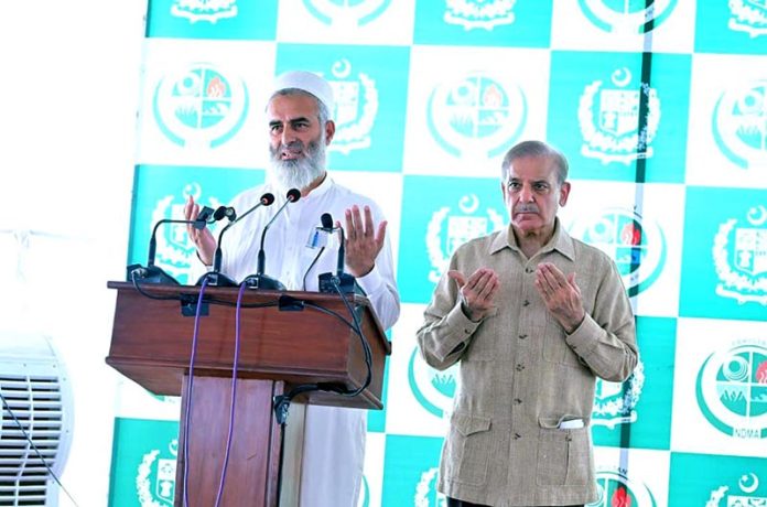 Prime Minister Muhammad Shehbaz Sharif offering fateha for the deceased in the recent torrential rains and floods in Khyber Pakhtunkhwa, Buner