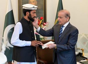 Prime Minister Muhammad Shehbaz Sharif presents prize cheques to Shepherds from Ghizer Gilgit Balitistan Wasiyat Khan, Ansar and Muhammad Khan, whose timely warning led to the safety of all residents from the disastrous Glacial Lake Outburst Flood (GLOF) in Ghizer Valley.
