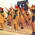 Schoolgirls perform on national songs at a function held at Government SD High School Bahawalpur to mark the Marka-e-Haq and Independence Day celebrations