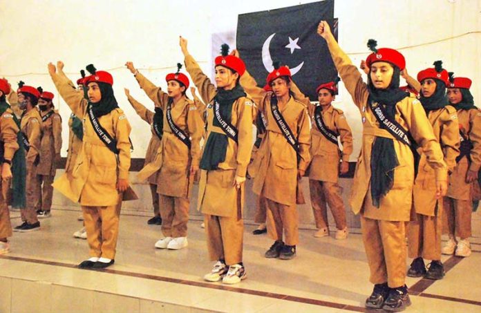 Schoolgirls perform on national songs at a function held at Government SD High School Bahawalpur to mark the Marka-e-Haq and Independence Day celebrations
