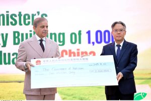 Ambassador of People's Republic of China H.E. Jiang Zaidong presents a relief cheque from the Government of China for the affectees of recent flash floods in Pakistan.