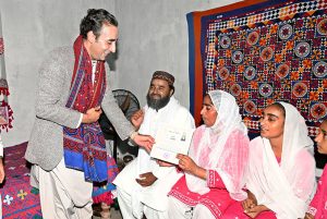 Chairman Pakistan People’s Party, Bilawal Bhutto Zardari distributes documents to flood affectees during his visit for Land titles distribution under construction of Sindh People’s Housing for Flood Affectees at New Tharo Wadho village in Mirokhan.