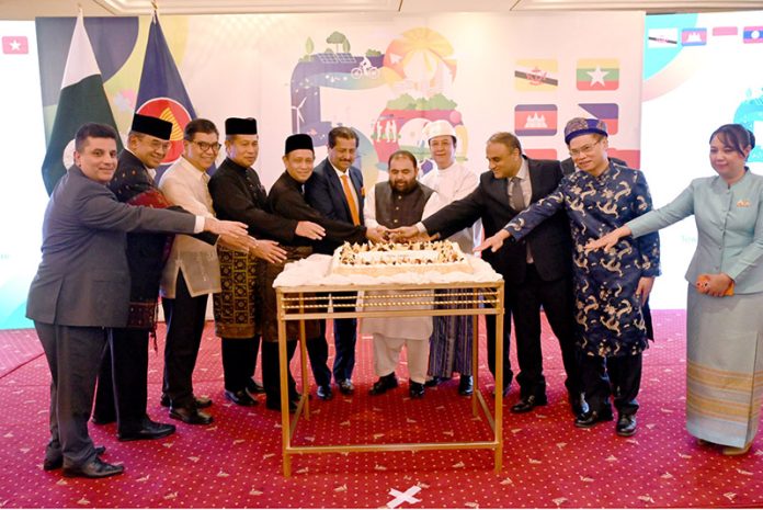 Federal Minister for National Heritage and Culture, Aurangzeb Khan Khichi and the representatives of ASEAN cutting cake at the “58 ASEAN Day” celebration towards an inclusive & Sustainable ASEAN Future