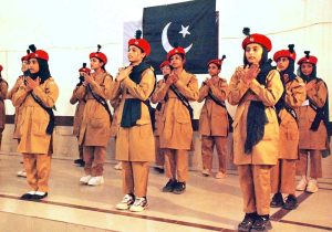 Schoolgirls perform on national songs at a function held at Government SD High School Bahawalpur to mark the Marka-e-Haq and Independence Day celebrations