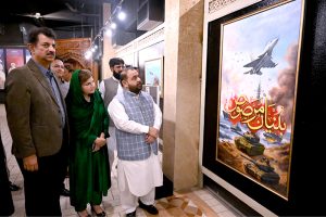 Federal Minister for National Heritage, Aurangzeb Khan Khichi and Parliamentary Secretary for Education, Heritage, and Culture, Ms. Farah Naz Akbar attending the cake-cutting ceremony in celebration of Marka-e-Haq and Independence Day of Pakistan at Lok Virsa