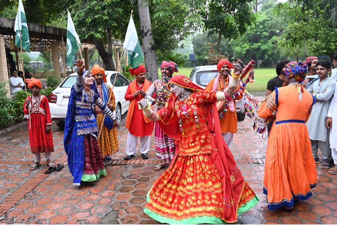 Artist performing folk dance in celebration of Marka-e-Haq and Independence Day of Pakistan at Lok Virsa