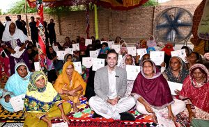 Chairman Pakistan People’s Party, Bilawal Bhutto Zardari distributes documents to flood affectees during his visit for Land titles distribution under construction of Sindh People’s Housing for Flood Affectees at New Tharo Wadho village in Mirokhan.