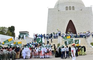 Students wave the national flags at Mazar-e-Quaid on the occasion of observing Youm-e-Istehsal, marking the sixth anniversary of India’s illegal actions of August 5, 2019, in Indian Illegally Occupied Jammu and Kashmir (IIOJK).