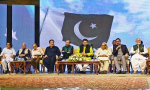 Sindh Governor Kamran Khan Tessori, Sehar Ansari, KPC President Fazil Jamili, and others seated on stage during a Mushaira held at the Governor House as part of the Marka-e-Haq celebrations