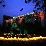 An illuminated view of the Associated Press of Pakistan Headquarters building, decorated with colourful lights in connection with Independence Day celebrations.
